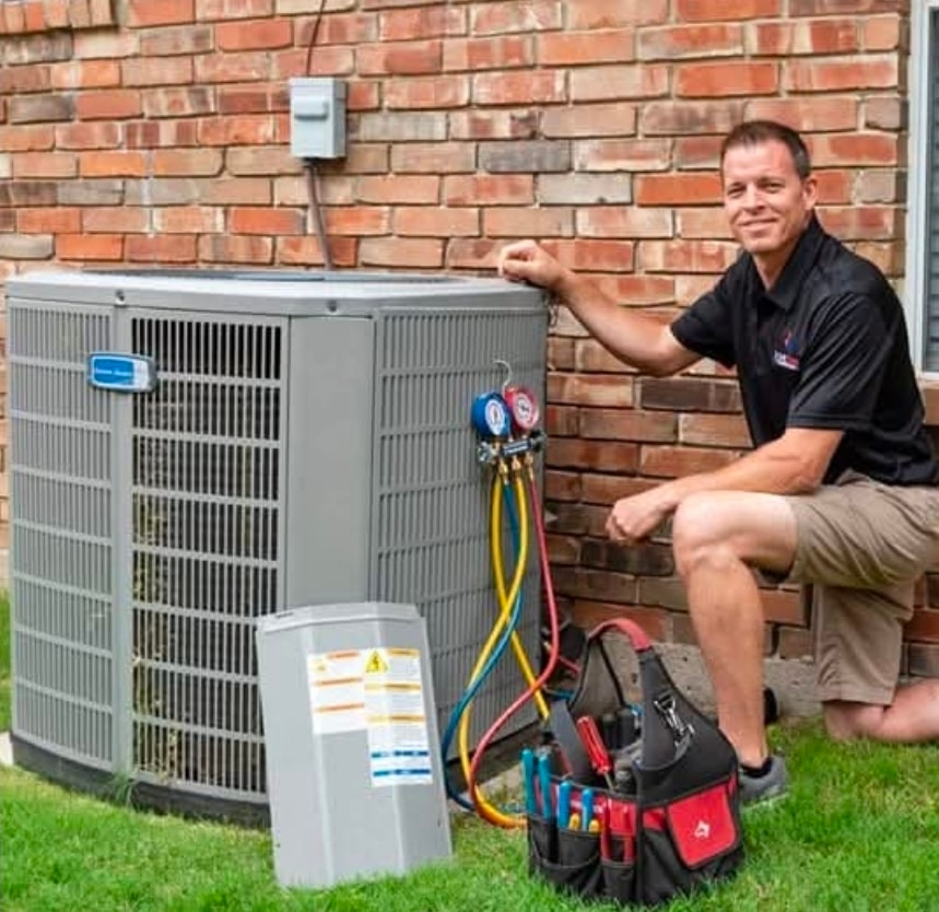 Lone Star Comfortaire technician servicing AC unit
