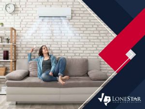 woman operating an air conditioner while sitting on a couch